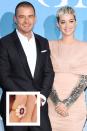 <p>Katy announced her engagement to Orlando Bloom with a sweet Instagram post on Valentine's Day. The actor proposed <a href="https://www.townandcountrymag.com/style/jewelry-and-watches/a26360336/katy-perry-engagement-ring-worth-cost-details/" rel="nofollow noopener" target="_blank" data-ylk="slk:with a one-of-a-kind sparkler;elm:context_link;itc:0;sec:content-canvas" class="link ">with a one-of-a-kind sparkler</a> featuring a ruby or vivid pink diamond center stone weighing between two to two and a half carats in size. The overall cost of the ring may range between $500,000 and $2,000,000 (or even more!). </p>