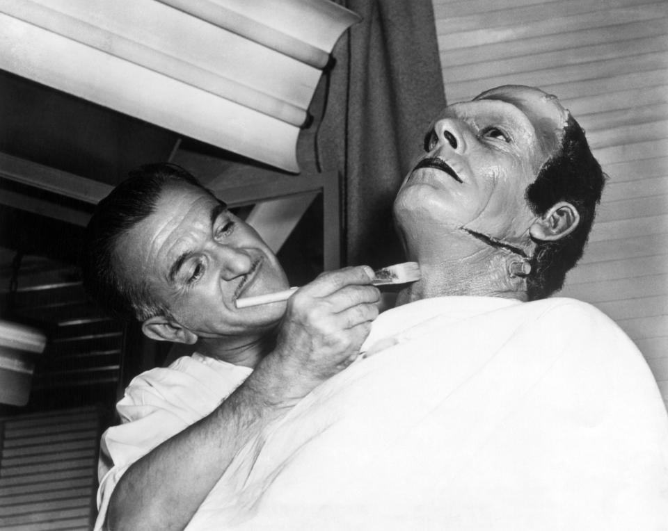 makeup artist Jack P. Pierce turning Glenn Strange into the 'Frankenstein monster'