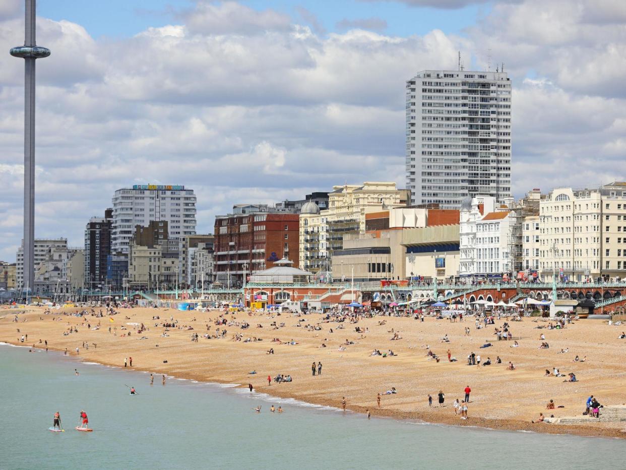 People enjoy the sun at the beach in Brighton on 11 July, 2020: Aaron Chown/PA Wire