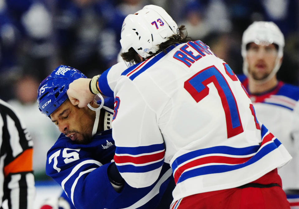 New York Rangers' Matt Rempe (73) and Toronto Maple Leafs' Ryan Reaves (75) fight during the third period of an NHL hockey game in Toronto on Saturday, March 2, 2024. (Frank Gunn/The Canadian Press via AP)