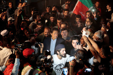 Opposition politician Imran Khan (C) arrives at a celebration rally in Islamabad, Pakistan November 2, 2016. REUTERS/Caren Firouz