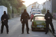 <p>Special police officers secure a street near the house where a Syrian man lived before the explosion in Ansbach, southern Germany, Monday, July 25, 2016. (AP Photo/Matthias Schrader)</p>