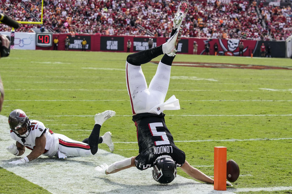 Atlanta Falcons wide receiver Drake London (5) falls after a hit by Tampa Bay Buccaneers safety Antoine Winfield Jr. (31) during the second half of an NFL football game, Sunday, Oct. 22, 2023, in Tampa, Fla. (AP Photo/Chris O'Meara)