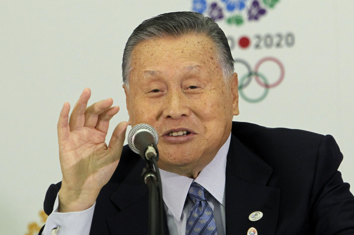 FILE - In this Jan. 24, 2014, file photo, former Japanese Prime Minister Yoshiro Mori answers a reporter's question at a press conference in Tokyo as Mori was officially appointed head of the Tokyo 2020 Summer Olympic organizing committee. Mori resigned Friday, Feb. 12, 2021 as the president of the Tokyo Olympic organizing committee following sexist comments implying women talk too much. (AP photo/Junji Kurokawa, File)