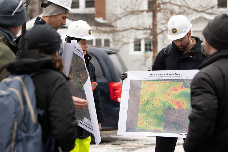 Nathan Graber of the DEC displays a magnetic survey map in Olean, New York