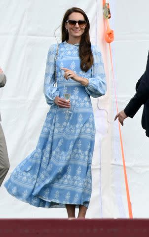 <p>Karwai Tang/WireImage</p> Kate Middleton sips champagne at the charity polo match where Prince William played on July 6