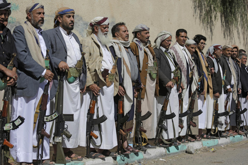 Tribesmen loyal to the Houthi rebels hold their weapons during a gathering aimed at mobilizing more fighters for the Houthi movement in Sanaa, Yemen, Tuesday, Feb. 25, 2020. (AP Photo/Hani Mohammed)