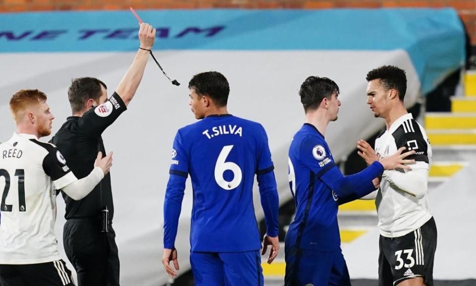 Fulham’s Antonee Robinson is shown a straight red card for a challenge on Chelsea’s César Azpilicueta just before half-time