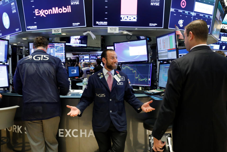 Traders work on the floor of the New York Stock Exchange (NYSE) in New York, U.S., September 18, 2018. REUTERS/Brendan McDermid