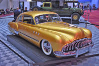 <p>This elegant custom creates a fastback version of the Buick Y-job by shortening and lowering the standard car, which also rides 15 inches lower than stock on AirRide suspension. The body underwent extensive reshaping and smoothing, with the headlights repositioned behind the <strong>huge chrome grille</strong>.</p>