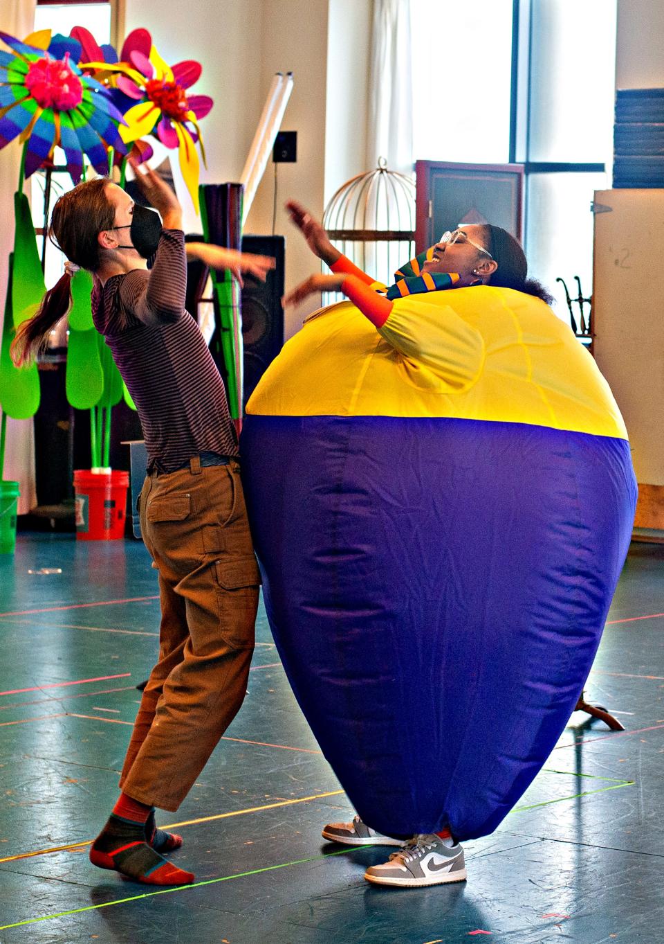 Keegan Robinson, left, as Tweedle Dee rehearses with Antonisia Collin of Montgomery in her inflatable suit as Tweedle Dum for "Alice in Wonderland" at Children's Theatre Company.