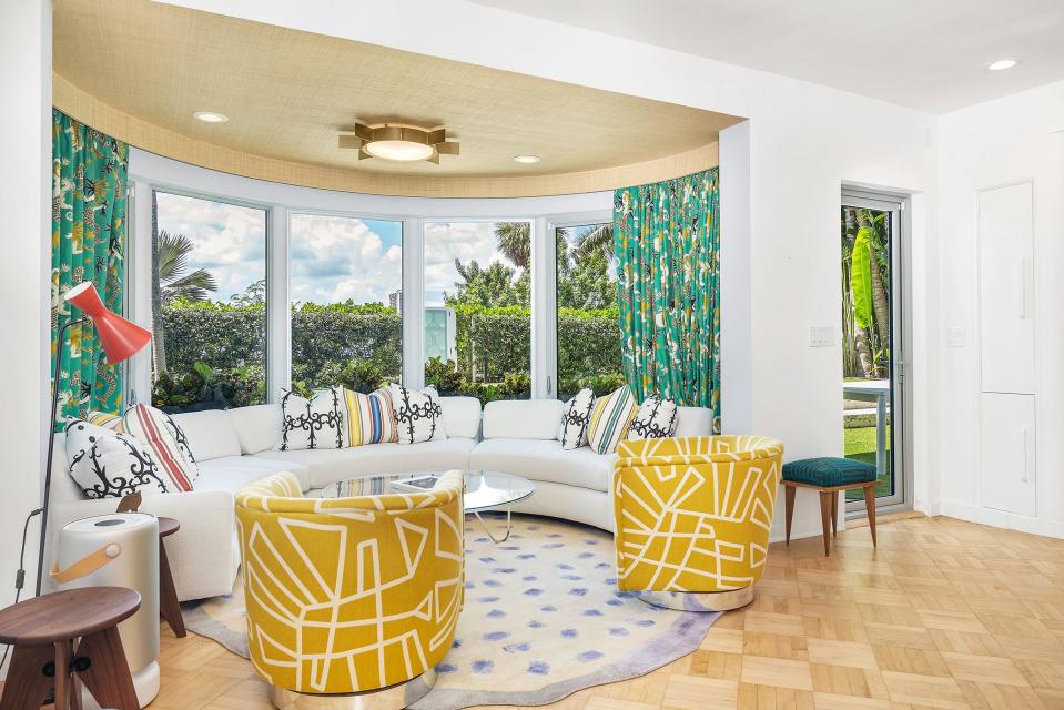 A large bow window is among the architectural details at 1221 N. Lake Way, a landmarked Palm Beach house that just entered the market with an asking price of $30 million.