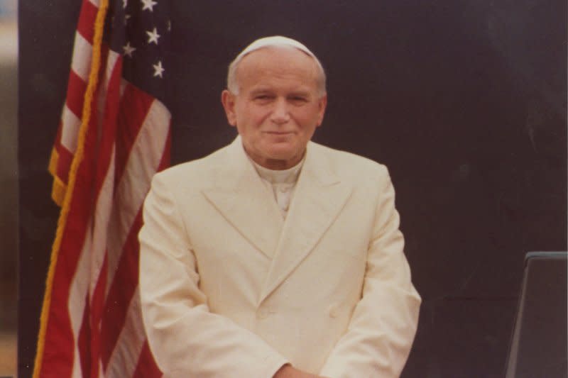 Pope John Paul II poses for a picture while meeting President Ronald Reagan while crossing paths in Anchorage, Alaska, May 2, 1984. On October 22, 1978, Pope John Paul II was installed as pontiff of the Roman Catholic Church. File Photo by Wally McNamee/UPI