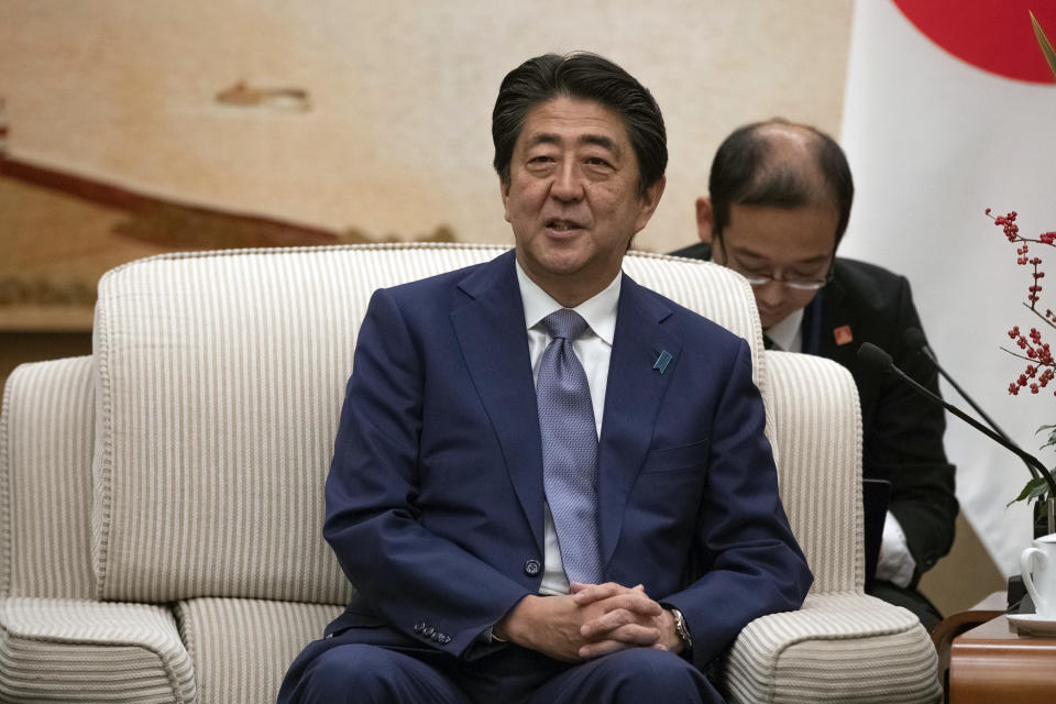 Japanese Prime Minister Shinzo Abe meets with Chinese Premier Li Keqiang at the Great Hall of the People in Beijing, Thursday, Oct. 25, 2018. Abe arrived in Beijing on Thursday as both countries try to repair ties that have been riven by disputes over territory, military expansion in the Pacific and World War II history. (Roman Pilipey/Pool Photo via AP)