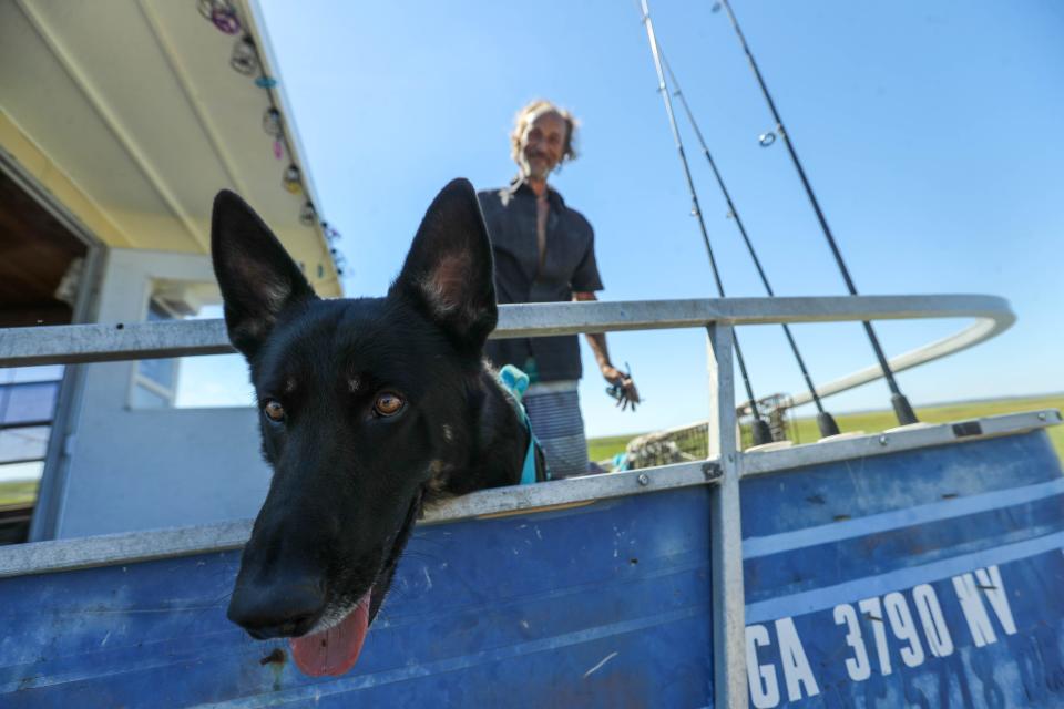 Huck and Creed are still living on a pontoon boat that is currently stranded on the shoulder of US 80 following high tides and wind from Hurricane Helene.