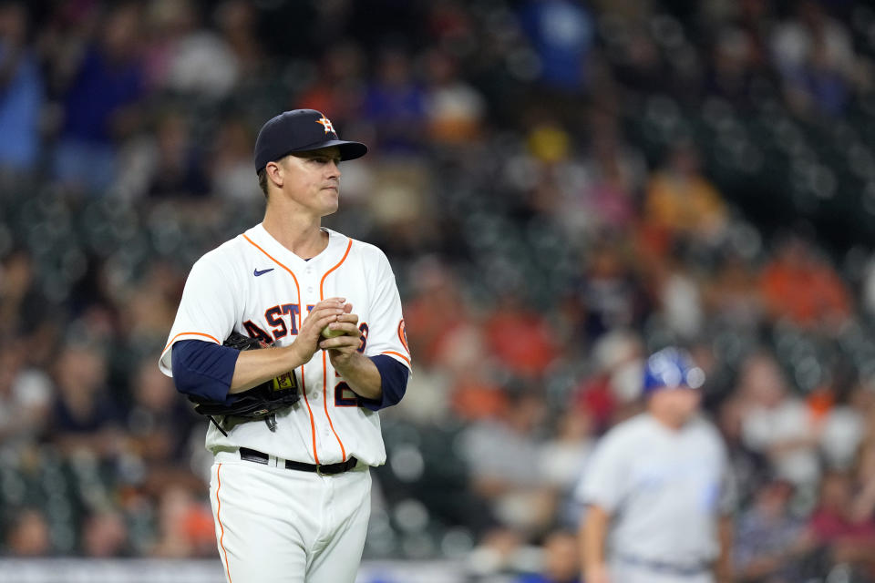 Houston Astros starting pitcher Zack Greinke reacts after giving up a home run to Kansas City Royals' Salvador Perez during the third inning of a baseball game Monday, Aug. 23, 2021, in Houston. (AP Photo/David J. Phillip)