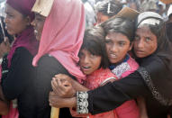 People wait to receive aid in Cox's Bazar, Bangladesh, September 25, 2017. REUTERS/Cathal McNaughton