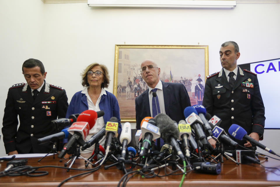 CORRECTS SPELLING OF PERSON AT RIGHT FROM GARGANO TO GARGARO - From left, Carabinieri Colonel Lorenzo D'Aloia, prosecutors Nunzia D'Elia, and Michele Pristipino, and Carabinieri General Francesco Gargaro arrive to a press conference about the investigation on the murder of Carabinieri's officer Mario Cerciello Rega in Rome, Tuesday, July 30, 2019. Two American teenagers were jailed in Rome on Saturday as authorities investigate their alleged roles in the fatal stabbing of the Italian police officer on a street near their hotel. (AP Photo/Andrew Medichini)