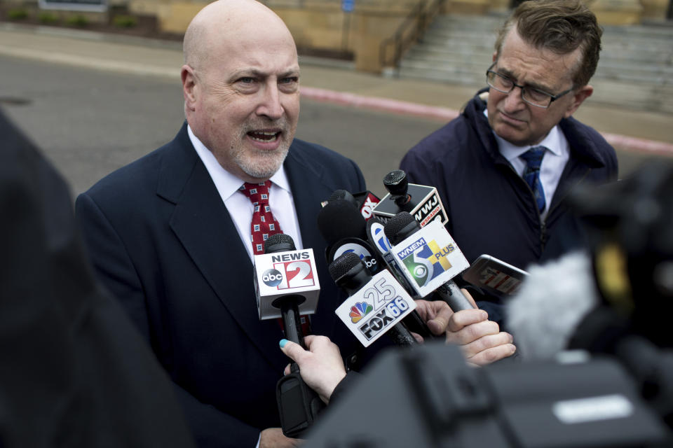 Retired Bishop Airport police Lt. Jeff Neville speaks to reporters outside the federal courthouse in Flint, Mich., Thursday, April 18, 2019. Amor Ftouhi, of Canada, convicted of terrorism for nearly killing Neville in June 2017, was sentenced Thursday to life in prison after defiantly declaring he had no regrets and only wished he had carried a machine gun that day instead of a knife. (Kaiti Sullivan/The Flint Journal via AP)