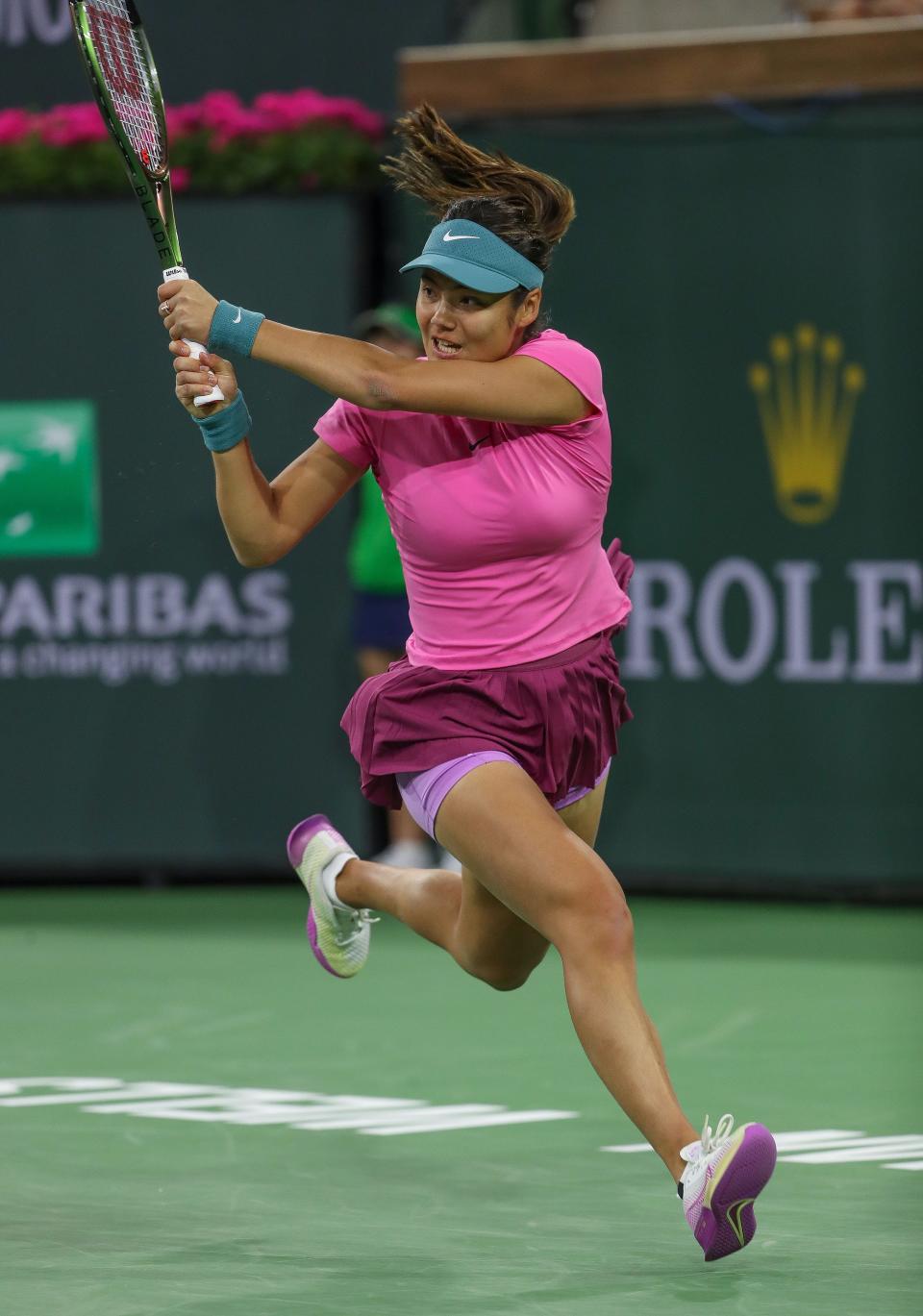 Emma Raducanu runs down a shot in her match against Iga Swiatek at the BNP Paribas Open in Indian Wells, Calif., March 14, 2023. 