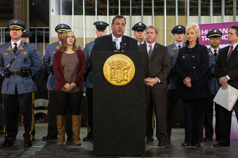 EAST RUTHERFORD, NJ - JANUARY 29:  New Jersey Gov. Chris Christie (6th L) speaks at a press conference announcing new objectives to crack down on human and sex trafficking throughout the state of New Jersey, inspired in part by the upcoming Super Bowl, on January 29, 2014 in East Rutherford, New Jersey. Christie Spoke along side New Jersey Attorney General John Hoffman and Cindy McCain, wife of Arizona Senator John McCain. (Photo by Andrew Burton/Getty Images)
