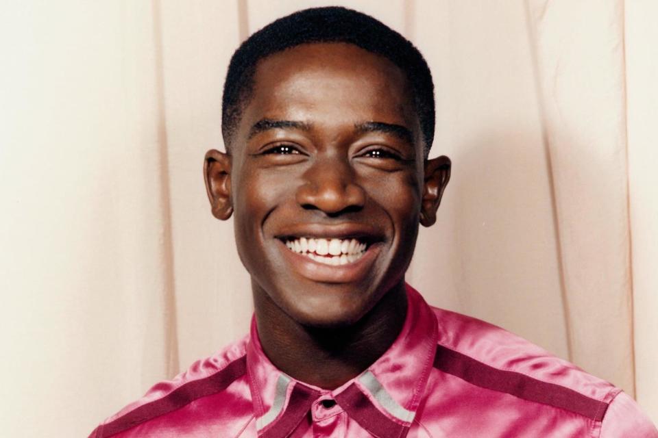 Damson Idris photographed by Thomas Cooksey. Styled by Sophie Paxton. COACH 1941 shirt, from £195 (uk.coach.com)