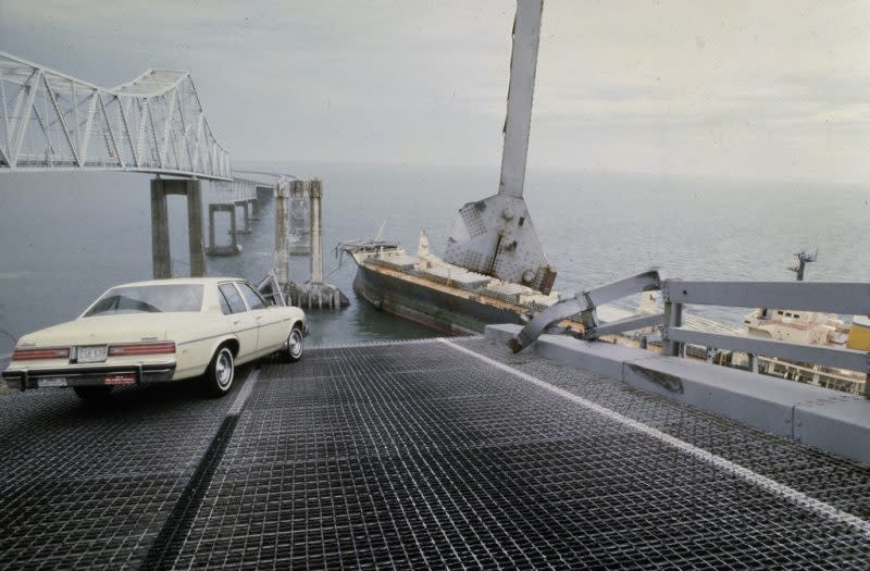 A car is halted at the edge of the Sunshine Skyway Bridge across Tampa Bay, Florida, after the freighter Summit Venture struck the bridge during a thunderstorm and tore away a large part of the span, May 9 1980. (AP Photo/Jackie Green, File)