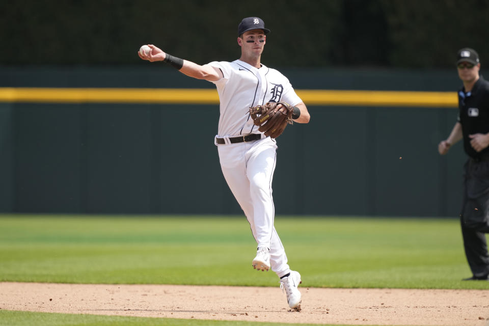 Detroit Tigers second baseman Zack Short fields the grounder but is unable to throw out Arizona Diamondbacks' Jake McCarthy at first during the seventh inning of a baseball game, Saturday, June 10, 2023, in Detroit. (AP Photo/Carlos Osorio)