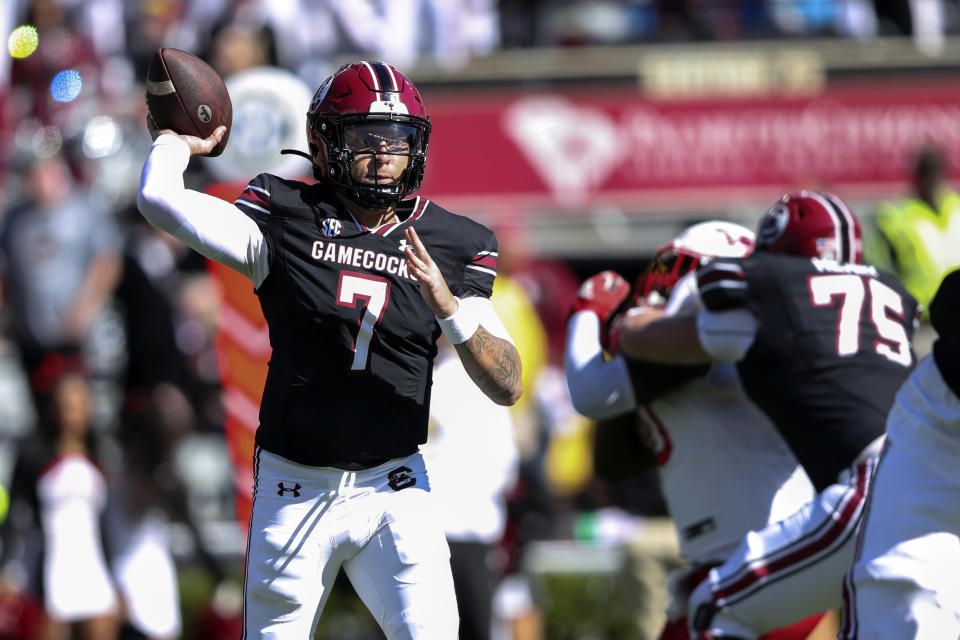 South Carolina quarterback Spencer Rattler (7) throws a short pass to the sideline during the first half of an NCAA college football game against Jacksonville State, Saturday, Nov. 4, 2023, in Columbia, S.C. (AP Photo/Artie Walker Jr.)