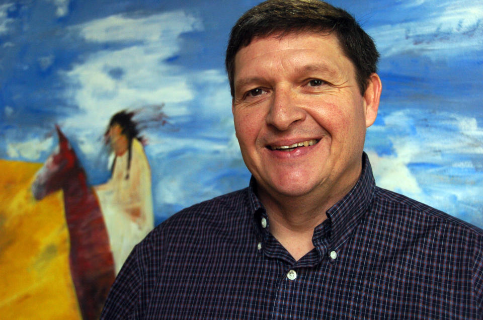 In this Friday, Nov. 16, 2012 photo, Gerald Gray, the incoming chairman of Montana's Little Shell Chippewa Tribe, poses for a photo at the advertising agency where he works in Billings, Mont. Gray says his plan to create tribal-operated business ventures could help make the Little Shell more self-sufficient. (AP Photo/Matthew Brown)