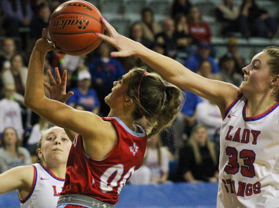 Claude's Bobbie Fouquet (33) blocks the shot of Borden County's Brette Kaite Behrens during a Region I-1A semifinal girls basketball game in the Texas Dome at Levelland on Friday, Feb. 24, 2023.