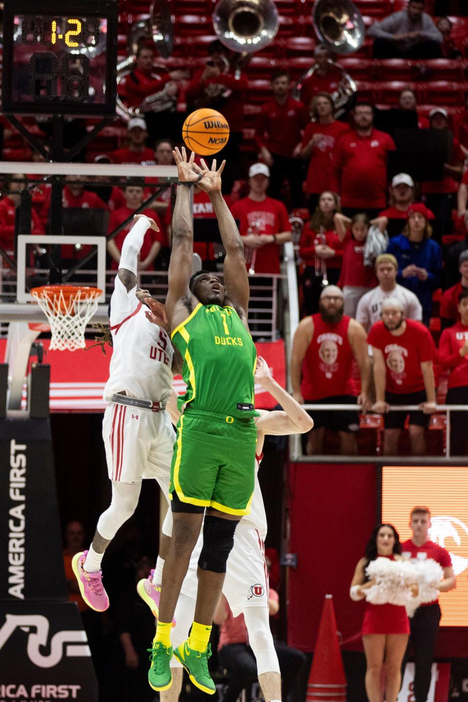 Utah Utes guard Deivon Smith (5) blocks Oregon Ducks center N’Faly Dante (1) at the Huntsman Center in Salt Lake City on Jan. 21, 2024. | Marielle Scott, Deseret News