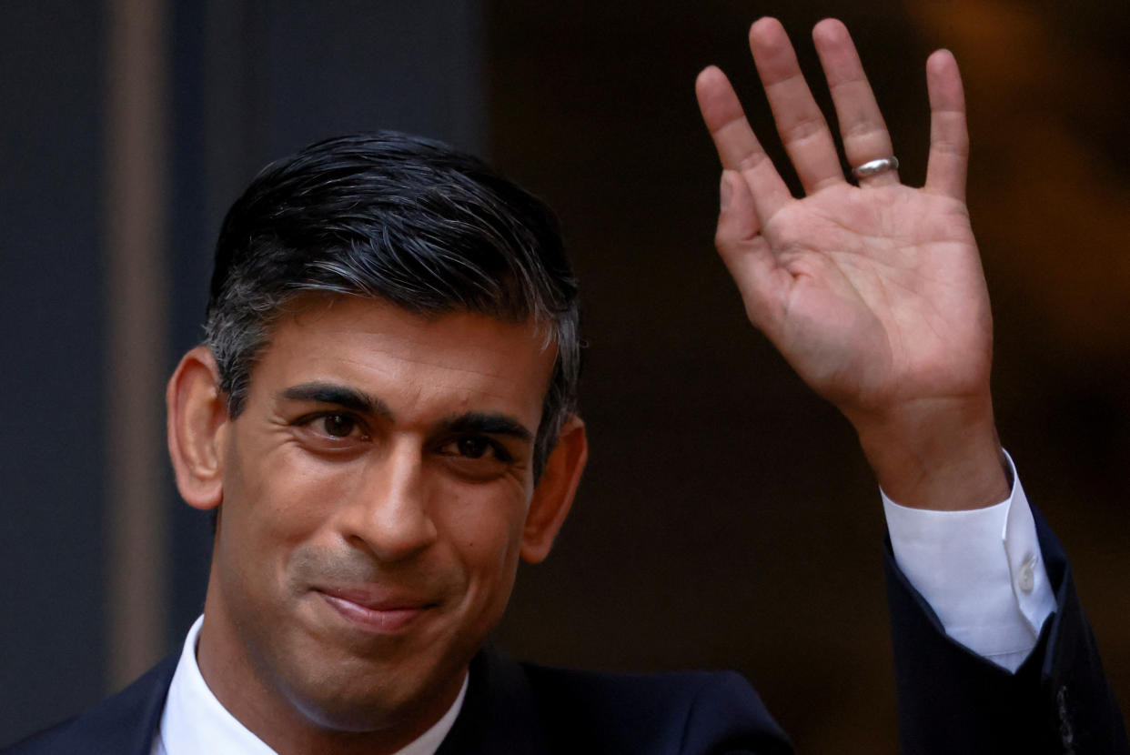 New leader of Britain's Conservative Party Rishi Sunak waves outside the party's headquarters in London, Britain, October 24, 2022. REUTERS/Henry Nicholls