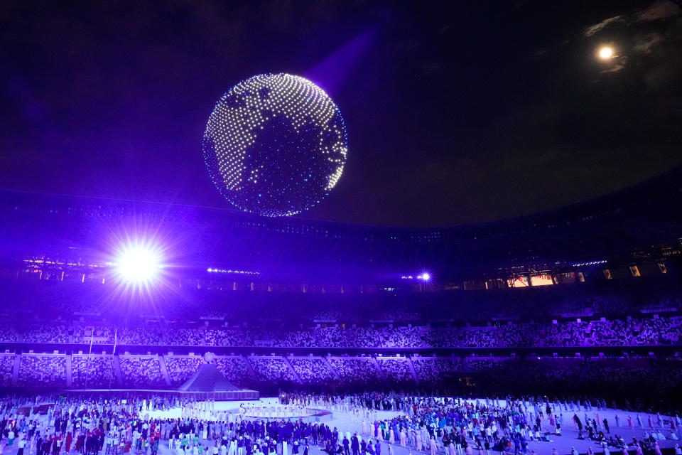 TOKYO, JAPAN - JULY 23: Drones fly to form an image of the Earth over the top of the stadium during the Opening Ceremony of the Tokyo 2020 Olympic Games at Olympic Stadium on July 23, 2021 in Tokyo, Japan. (Photo by Wei Zheng/CHINASPORTS/VCG via Getty Images)