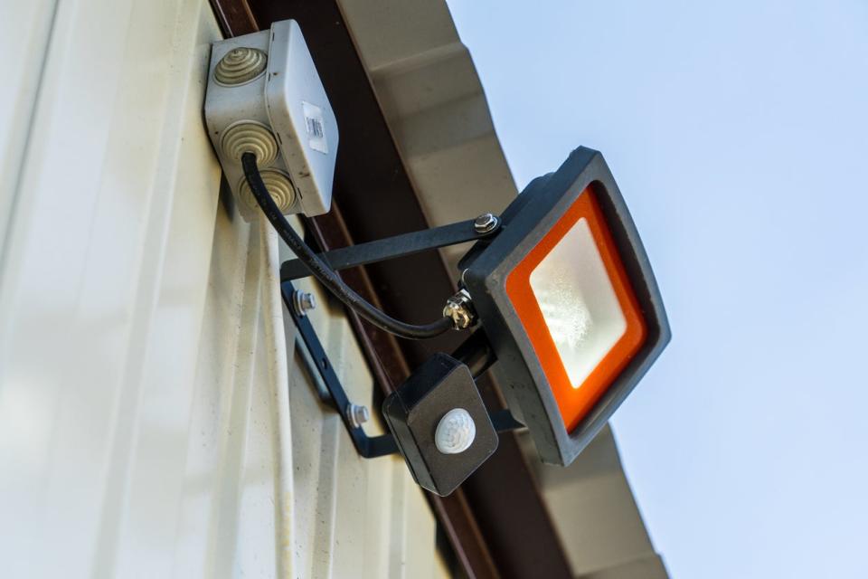 A close up of a motion sensor light. 