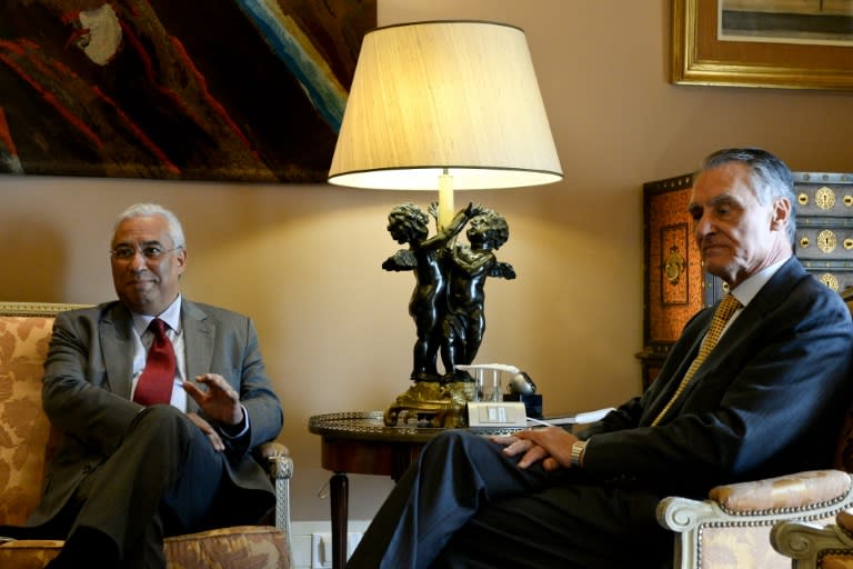 Portuguese President Anibal Cavaco Silva (R) holds a meeting with Socialist Party leader Antonio Costa (L) at the Belem Palace in Lisbon on November 24, 2015