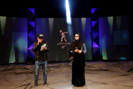 Zulala Hashimi 18 (R) and Sayed Jamal Mubarez 23 (L) singer finalists of the music contest 'Afghan Star', rehearse for the show in Kabul, Afghanistan March 19, 2017. REUTERS/Mohammad Ismail