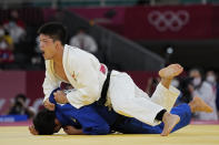 Shohei Ono of Japan reacts as he competes with Lasha Shavdatuashvili of Georgia during their men's -73kg judo final match, at the 2020 Summer Olympics in Tokyo, Japan, Monday, July 26, 2021. (AP Photo/Vincent Thian)