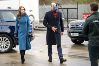 <p>Prince William and the Duchess of Cambridge spent three days <a href="https://www.townandcountrymag.com/society/tradition/a34891776/kate-middleton-prince-william-reindeer-royal-train-tour/" rel="nofollow noopener" target="_blank" data-ylk="slk:aboard the royal train;elm:context_link;itc:0;sec:content-canvas" class="link ">aboard the royal train</a>, touring Scotland, England, and Wales. On the tour's second day, Kate chose a tailored blue Catherine Walker coat. She accessorized with black leather gloves, heeled suede boots, and a blue floral mask. </p>