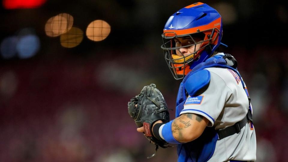 New York Mets catcher Francisco Alvarez (4) looks to the dugout for a signal in the eighth inning of the MLB National League game between the Cincinnati Reds and the New York Mets at Great American Ball Park in downtown Cincinnati on Tuesday, May 9, 2023 .