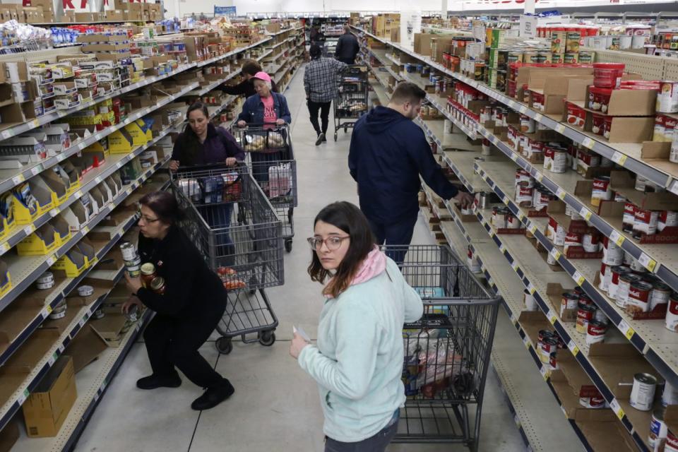 Shoppers stock up on canned items at WinCo Foods in Idaho Falls, Idaho, on March 13.