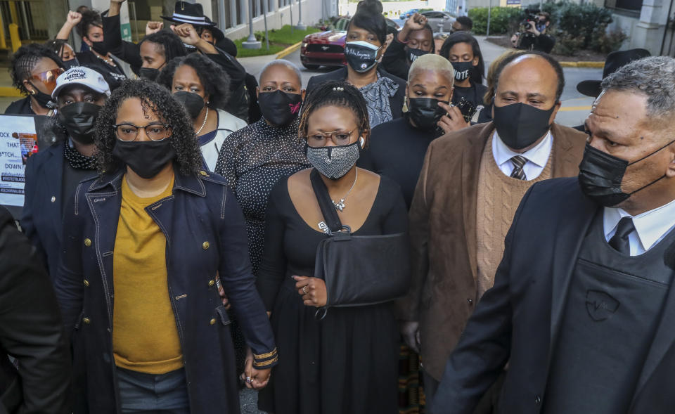 GA State Rep. Renitta Shannon, GA State Rep Park Cannon, Martin Luther King III march silently along Mitchell Street in front of the Capitol. (John Spink/AJC via Getty Images)

