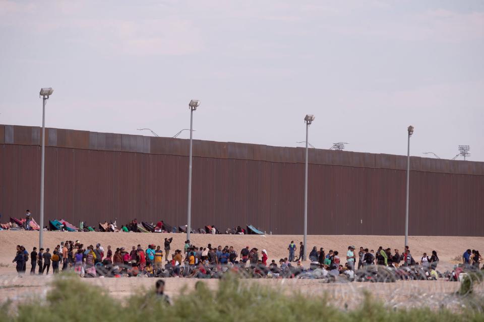 Migrants await to be processed by Border Patrol at gate 36 of the border wall on the border between Ciudad Juárez and El Paso, Texas on Sept. 20, 2023.