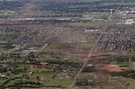 An aerial view of damage to neighborhoods in Moore, Oklahoma in this file photo from May 21, 2013, shows the path of destruction in the aftermath of a tornado which ravaged the suburb of Oklahoma City. REUTERS/Rick Wilking/Files