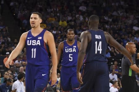 July 26, 2016; Oakland, CA, USA; USA guard Kevin Durant (5) is congratulated by forward Draymond Green (14) behind guard Klay Thompson (11) against China in the first quarter during an exhibition basketball game at Oracle Arena. Mandatory Credit: Kyle Terada-USA TODAY Sports