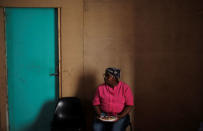 Vera Helena, 66, eats a meal on Mother's Day inside the abandoned Prestes Maia textile factory occupied by a homeless movement in downtown Sao Paulo, Brazil, May 13, 2018. "There was nothing when I arrived," said Vera, who lives here with her ex-husband and granddaughter. "It was empty. And we started to grab some wood and divide up the space." REUTERS/Nacho Doce