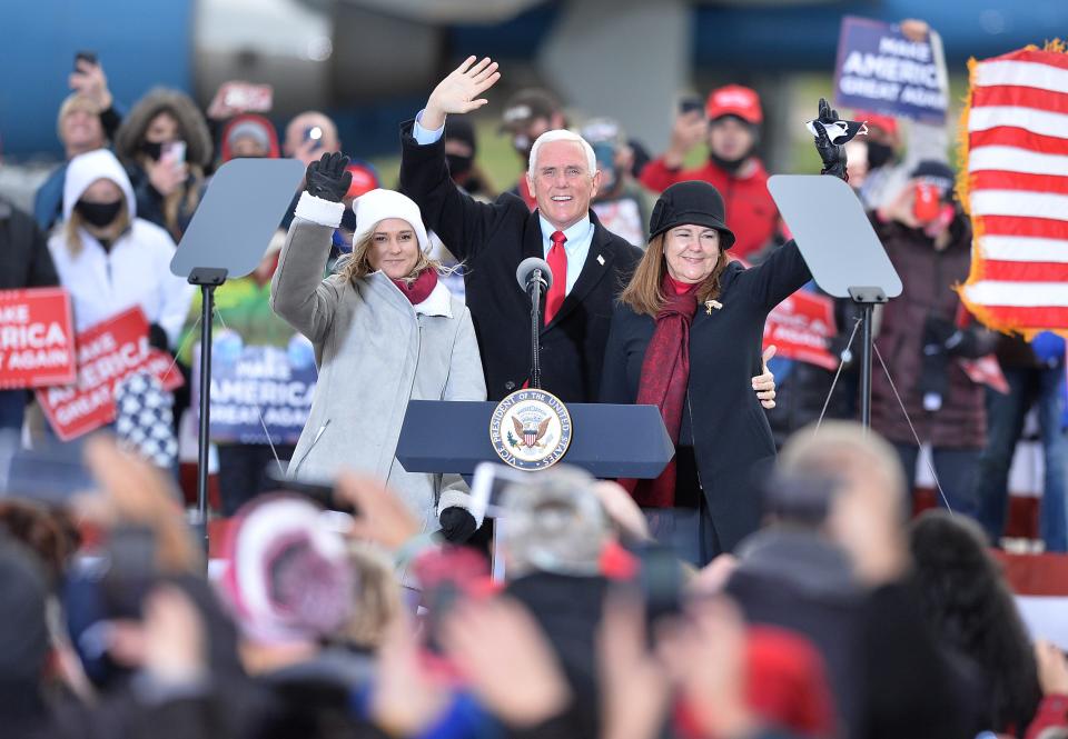 Charlotte Pence Bond; her father, Vice President Mike Pence; and mother Karen Pence wave to a crowd of about 300 people at a rally, Nov. 2, 2020, at North Coast Air at the Erie International Airport in Millcreek Township as representatives of the Biden and Trump campaigns canvassed Pennsylvania on the last day before the presidential election.