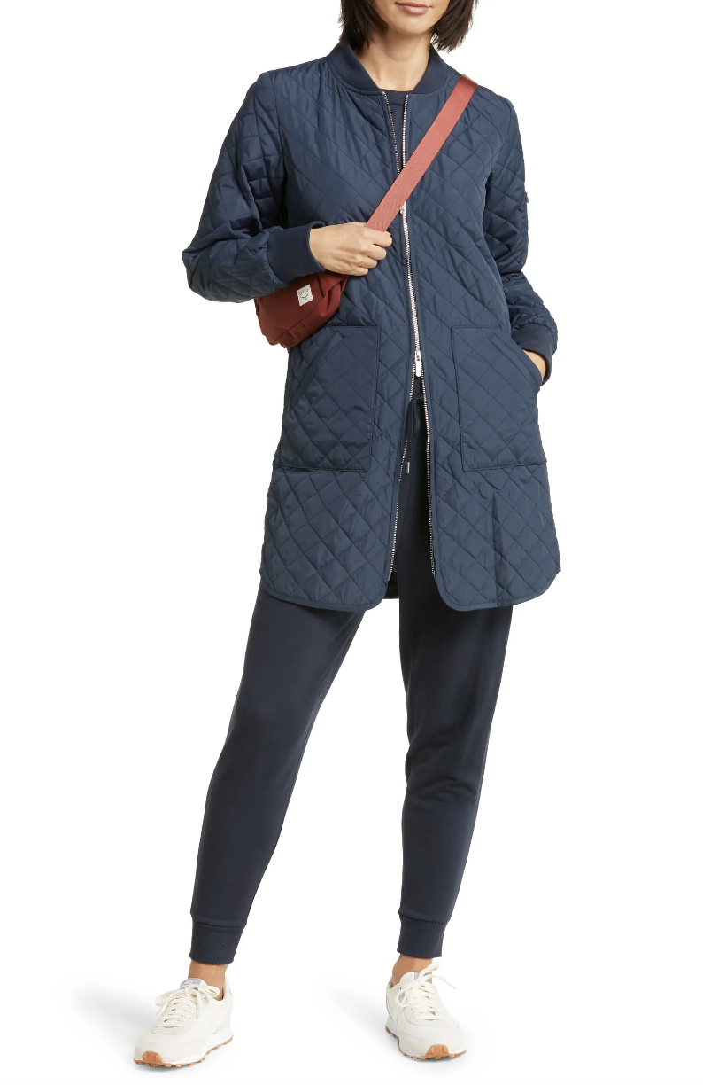 Zella Longline Water Resistant Quilted Bomber Jacket in navy eclipse (Photo via Nordstrom)