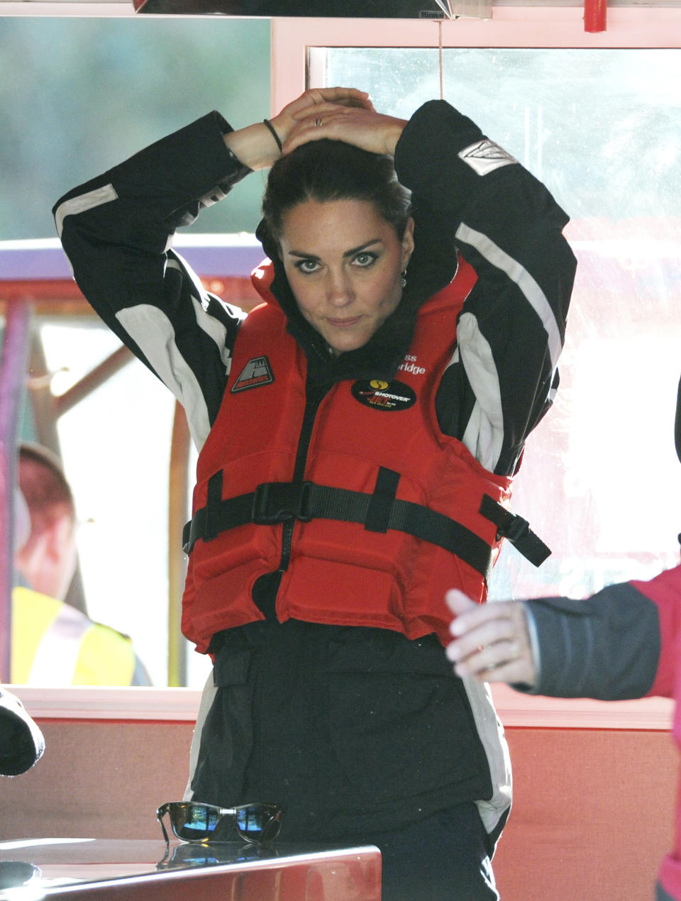 FILE - This is a Sunday, April 13, 2014 file photo of Britain's Kate Duchess of Cambridge prepares to taking a ride on a the Shotover Jetboat along the Shotover River, Queenstown, New Zealand, Sunday, April 13, 2014. Kate’s dilemma: What to pack for a two-week trip, when your itinerary includes everything from state receptions and church services to toddler playdates and cricket games? For the Duchess of Cambridge, who’s rounding up her trip to Australia and New Zealand with husband Prince William and 8-month-old son George, there were additional sartorial dilemmas: Do royals take off their shoes at the beach? And what’s the most ladylike way to climb into a fighter jet while in a pencil dress and high heels? (AP Photo/SNPA, Ross Setford) **NEW ZEALAND OUT**