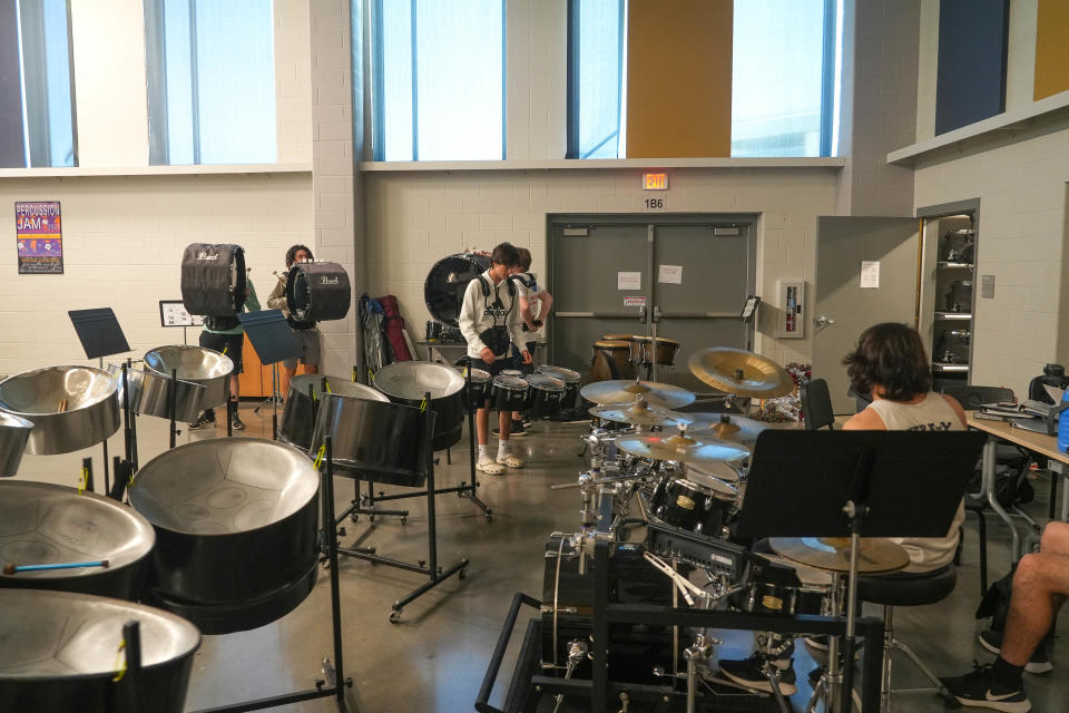 Percussionists practice in April in a room in the fine arts building at Moe & Gene Johnson High School. An upcoming bond would give the school funding to expand the campus, which would include an expansion to the building where the band practices.